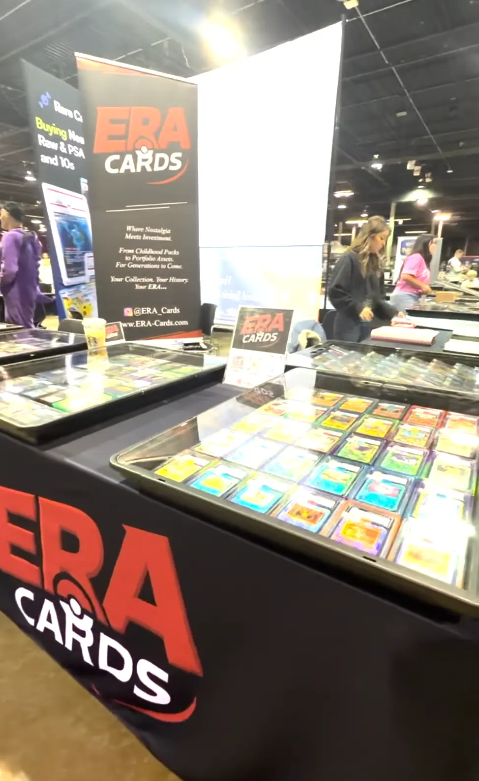 A case of graded Pokémon slabs beside the ERA Cards banner