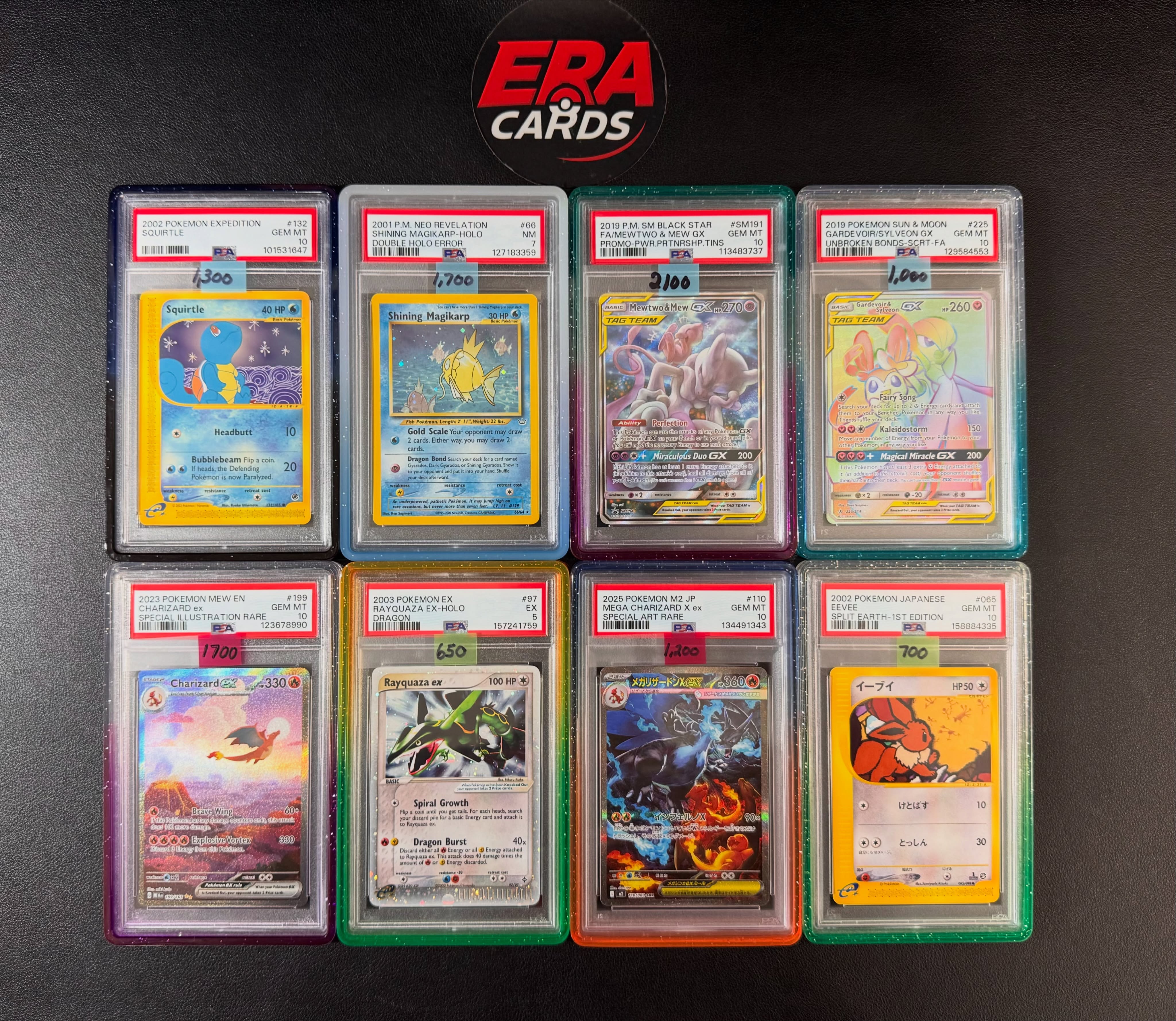 Updated slab inventory — including the PSA 10 Squirtle from Expedition and a wall of graded Charizards.
